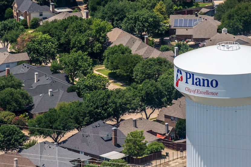 A water tower in Plano, where residents were being asked to conserve water through the weekend.