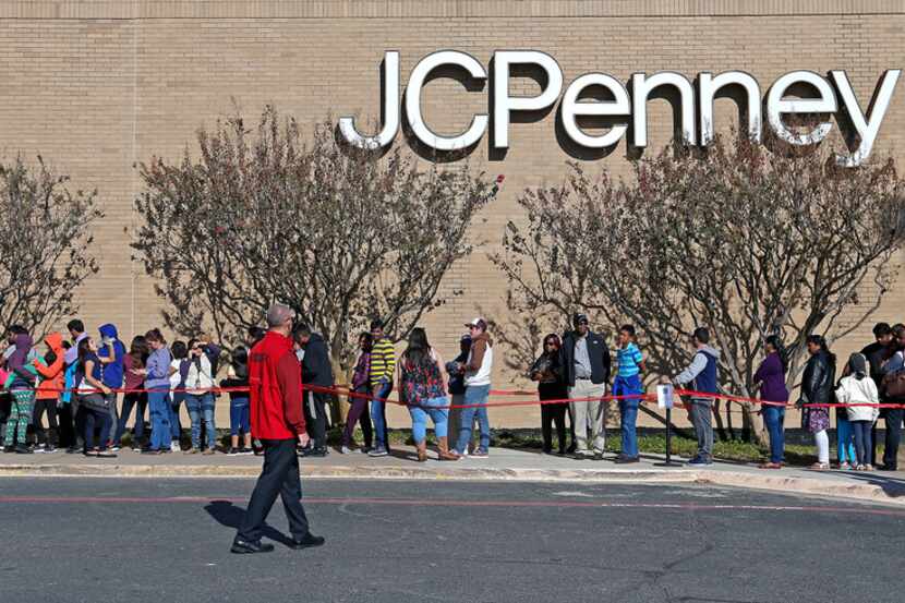 Shoppers stay in line to enter the J. C. Penney store at Collin Creek Mall in Plano, Texas,...