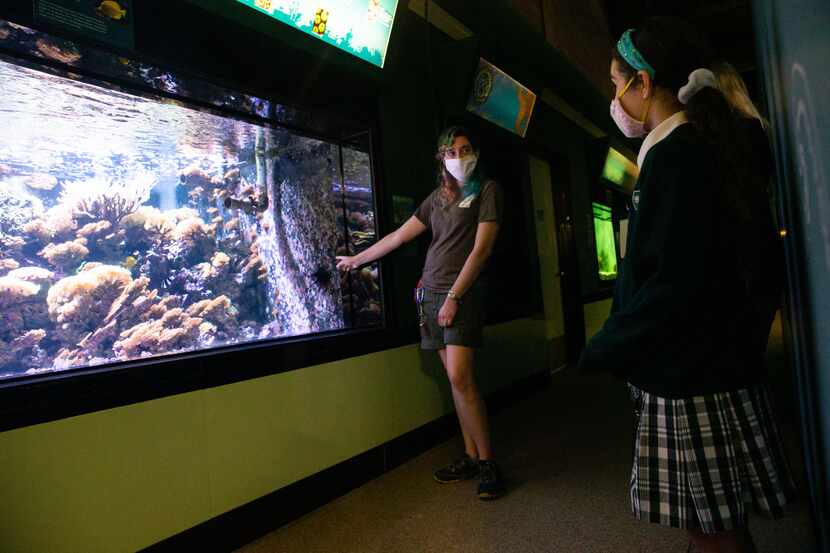 Margeaux Maurer (right), a fifth-grade student at The Hockaday School, listened to Laura...