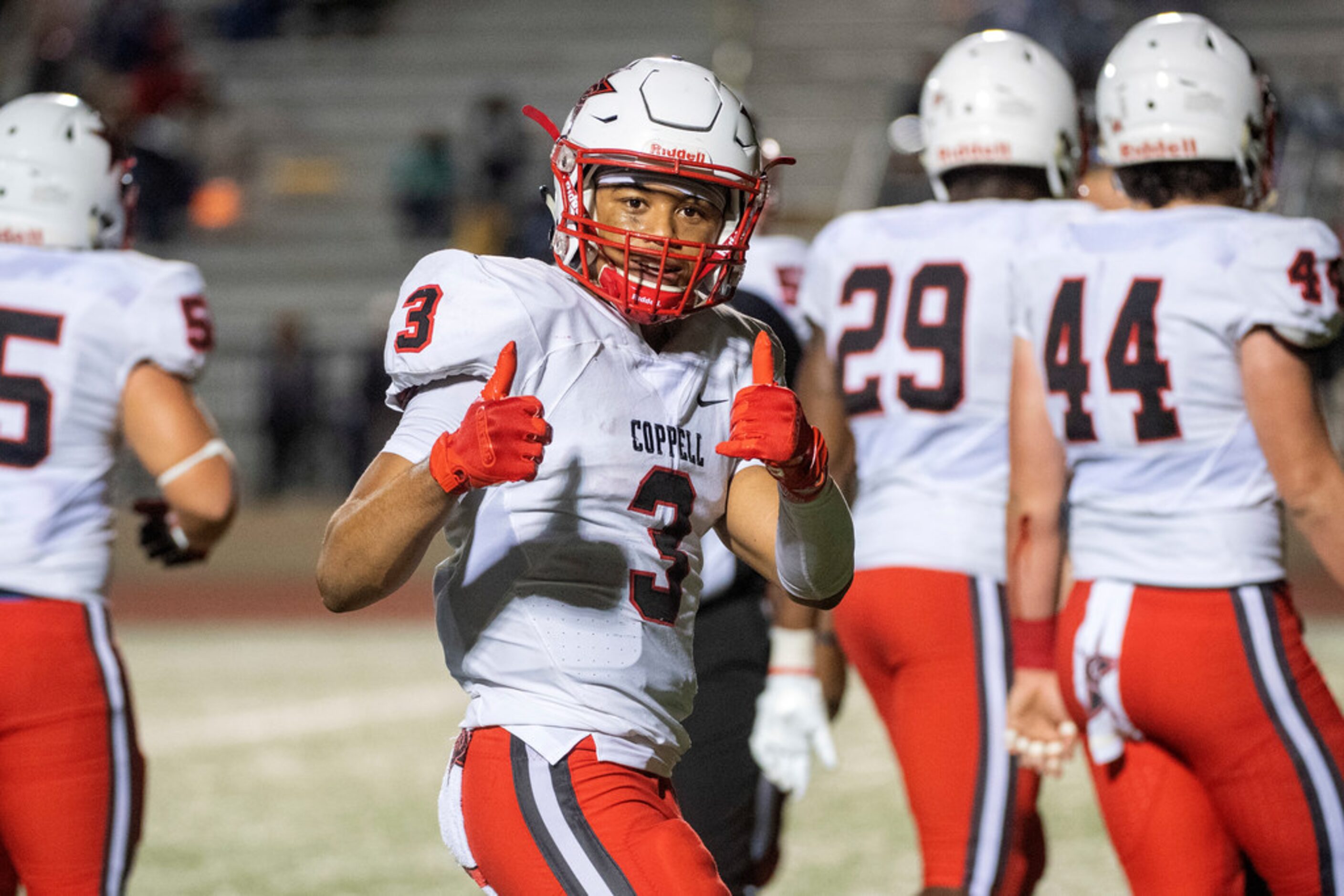 Coppell senior defensive back Jonathan McGill (3) gives two thumbs up to the camera during...