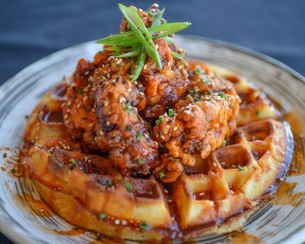 Korean fried chicken and waffles doenjang waffles, gochujang honey, sesame, fresh scallion...