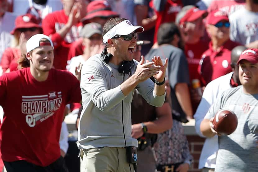 Oklahoma head coach Lincoln Riley celebrates after a blocked West Virginia kick during the...