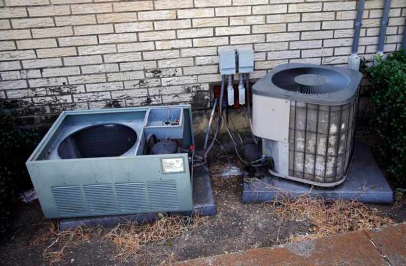 
A broken air conditioner sits at the apartment complex in the 1500 block of Dewberry...