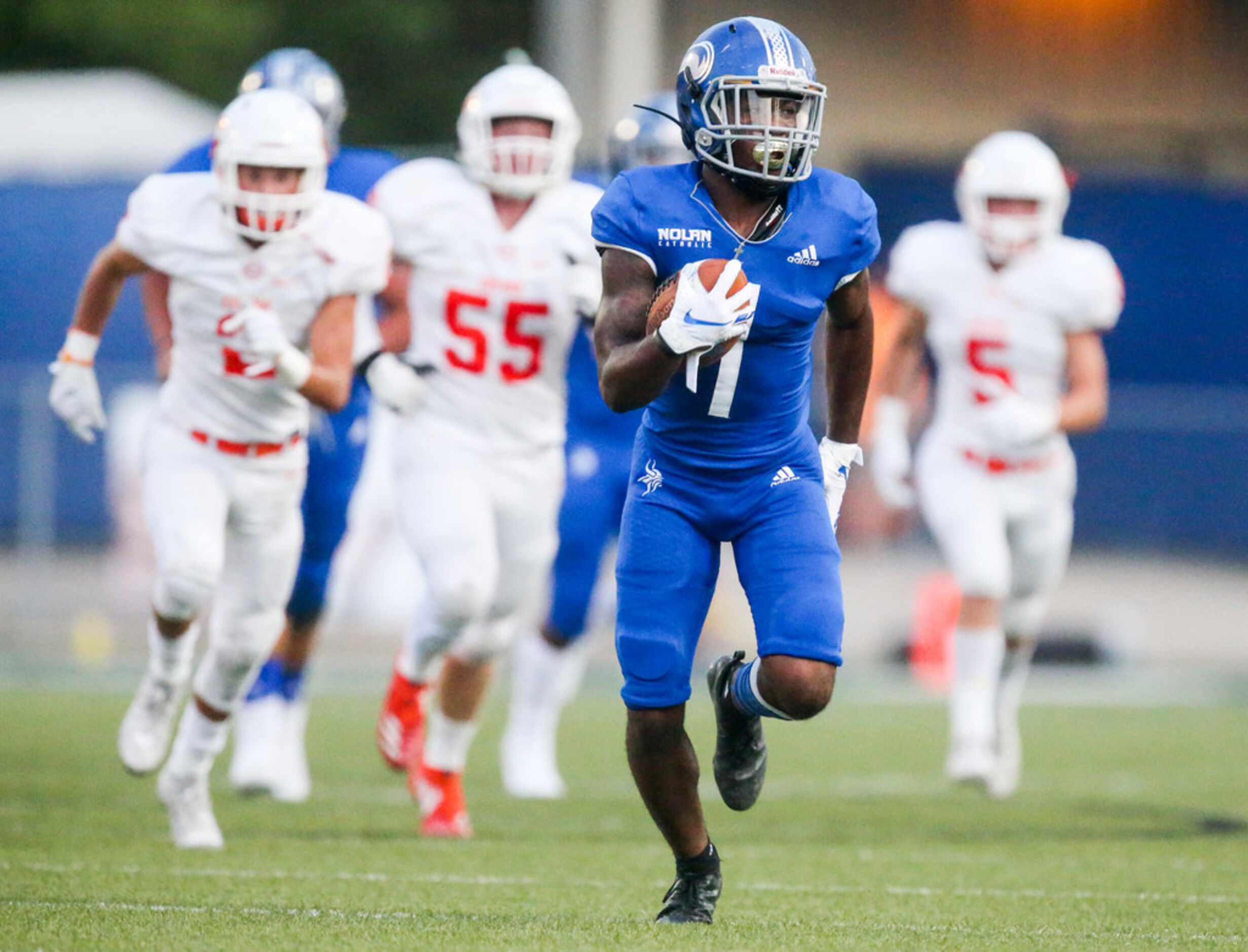 Nolan Catholic wide receiver Brandon Chatman (1) carries the ball for a touchdown during a...