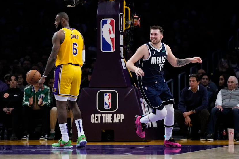 Dallas Mavericks' Luka Doncic (77) smiles after making a basket against Los Angeles Lakers'...