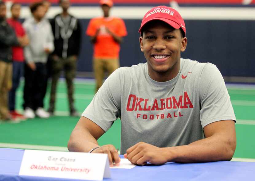 Allen linebacker Tay Evans poses for a photo at the table during Allen's signing day...