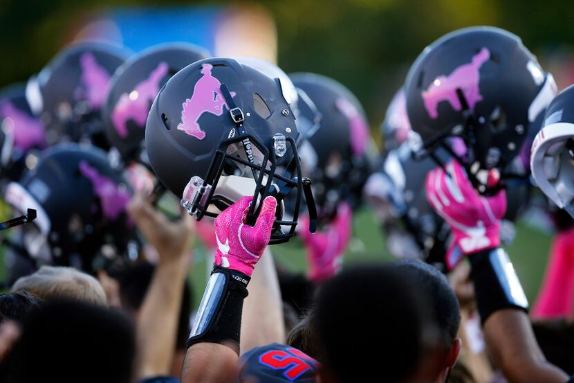 The Southern Methodist Mustangs football players will pay with pink ponies on their helmets...