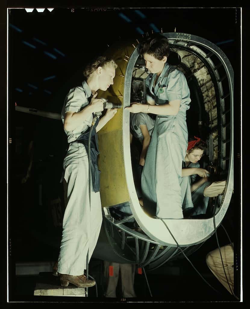 Riveters at work on fuselage of Liberator Bomber, Consolidated Aircraft Corp., Fort Worth in...
