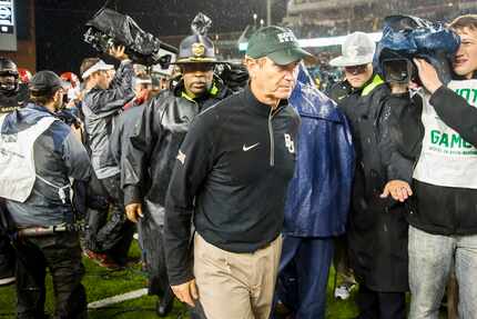 Art Briles leaves the field after a 44-34 loss to Oklahoma at McLane Stadium in what would...