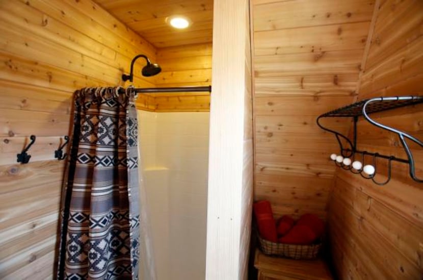 
A view inside the bathroom of a treehouse built by Pete Nelson for Bobby and Marty Page in...