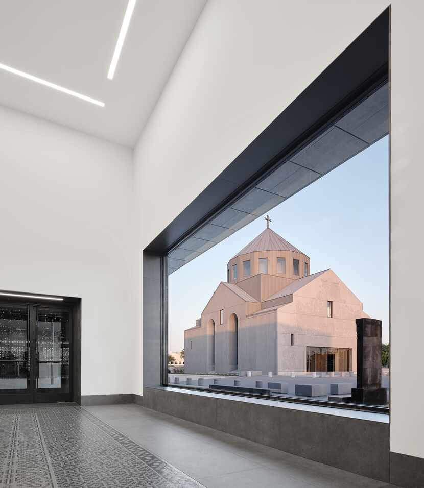 A picture window frames the view of St. Sarkis church from the vestibule of the community...