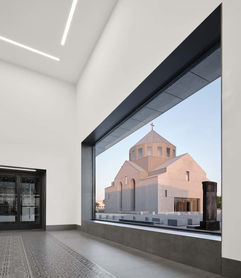 A picture window frames the view of St. Sarkis church from the vestibule of the community...