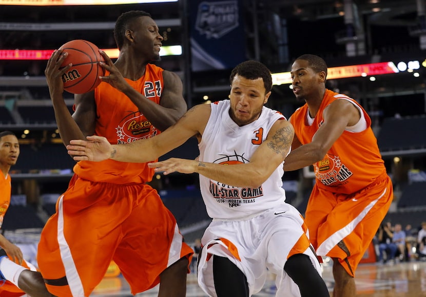 West guard Anthony Ireland (3) of Loyola Marymount tries  to steal the ball from East center...