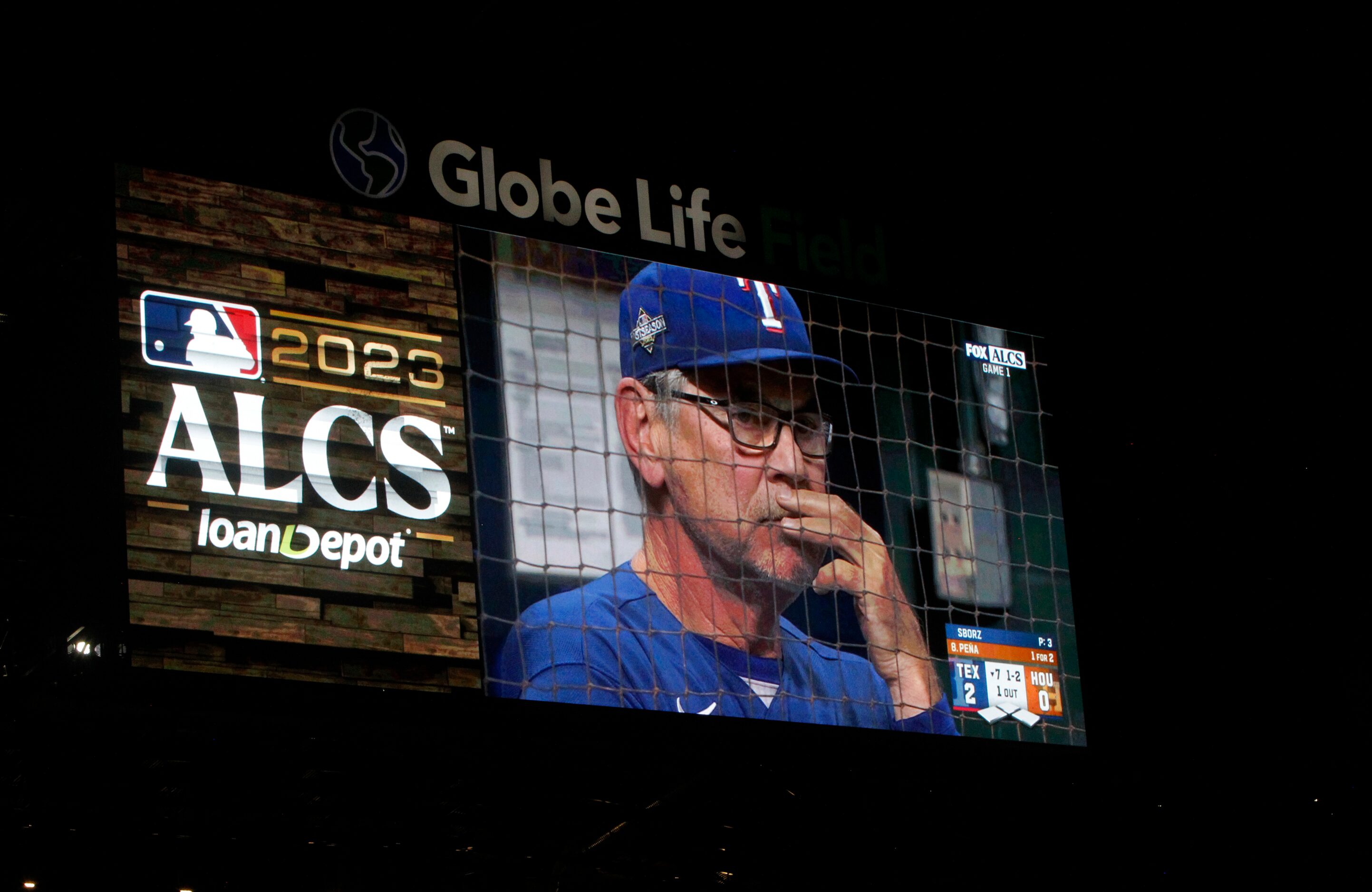 Texas Rangers manager Bruce Bochy loomed large on the big screen from the team dugout during...