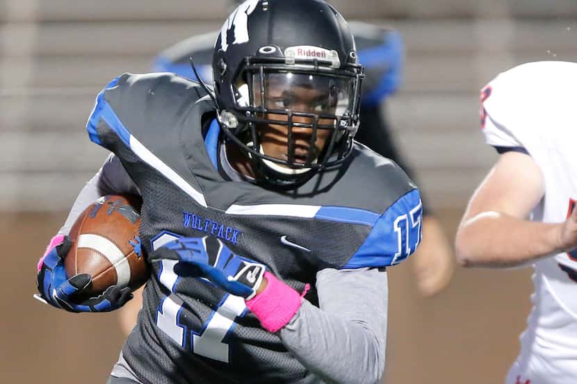 Plano West High School running back Kamryn Settles (17) carries the football during the...