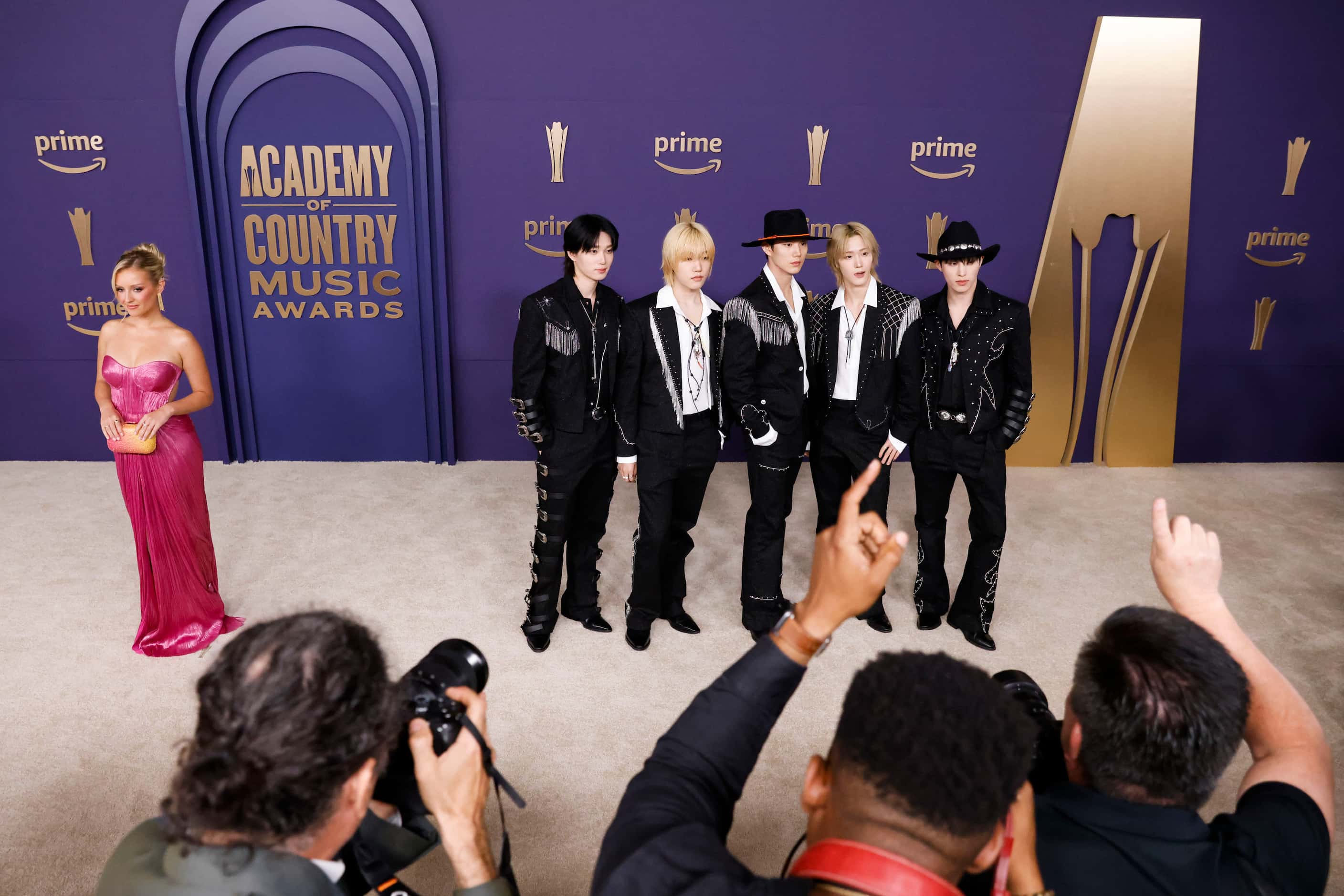 Daisy Kent (left) and P1Harmony arrive at the 59th Academy of Country Music Awards red...