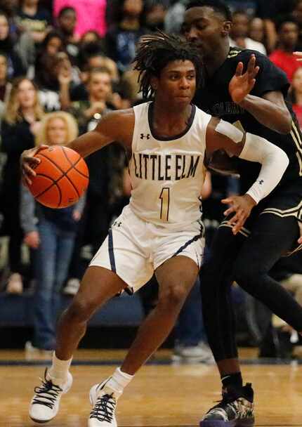 Little Elm guard Brandon Crossley (1) drives the basket during the second half as Little Elm...