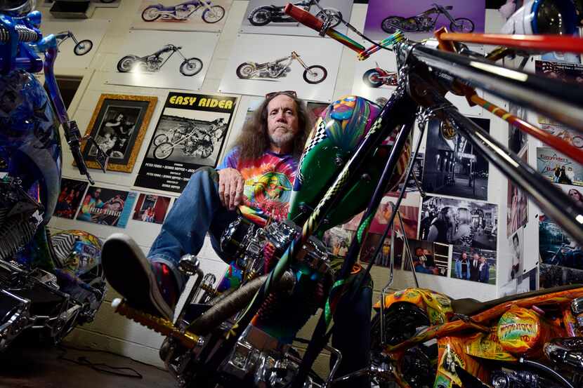 Owner Rick Fairless of Strokers Dallas with one of his custom Choppers named Susie, inside...