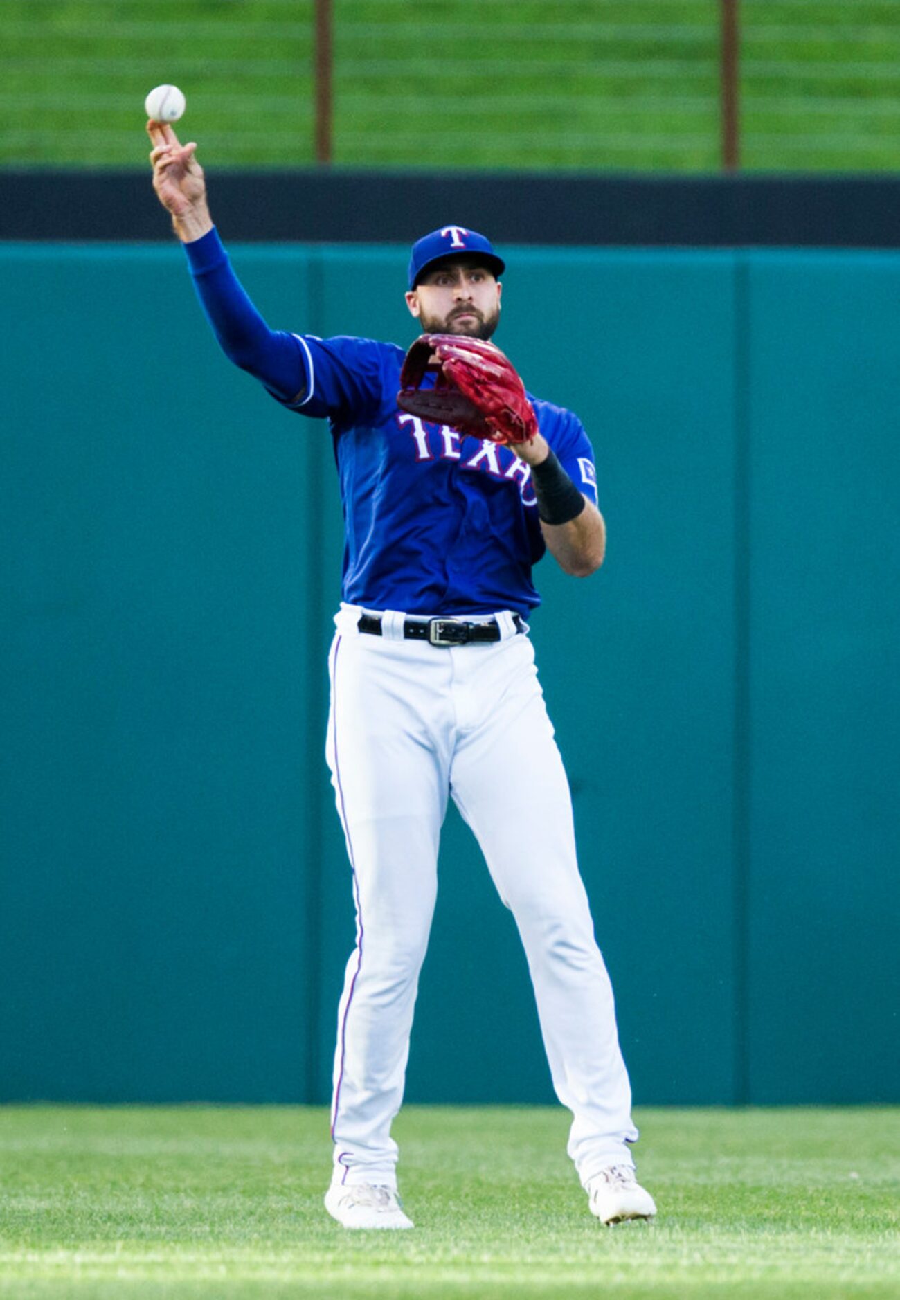 Texas Rangers center fielder Joey Gallo (13) throws back a fly ball to the outfield hit by...