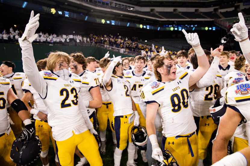 Highland Park players celebrate after winning a Class 5A Division I area-round playoff game...