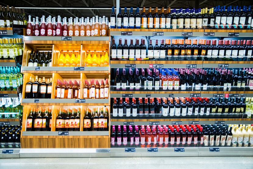 The wine section of a newly renovated Aldi grocery store on Gaston Avenue on Thursday,...