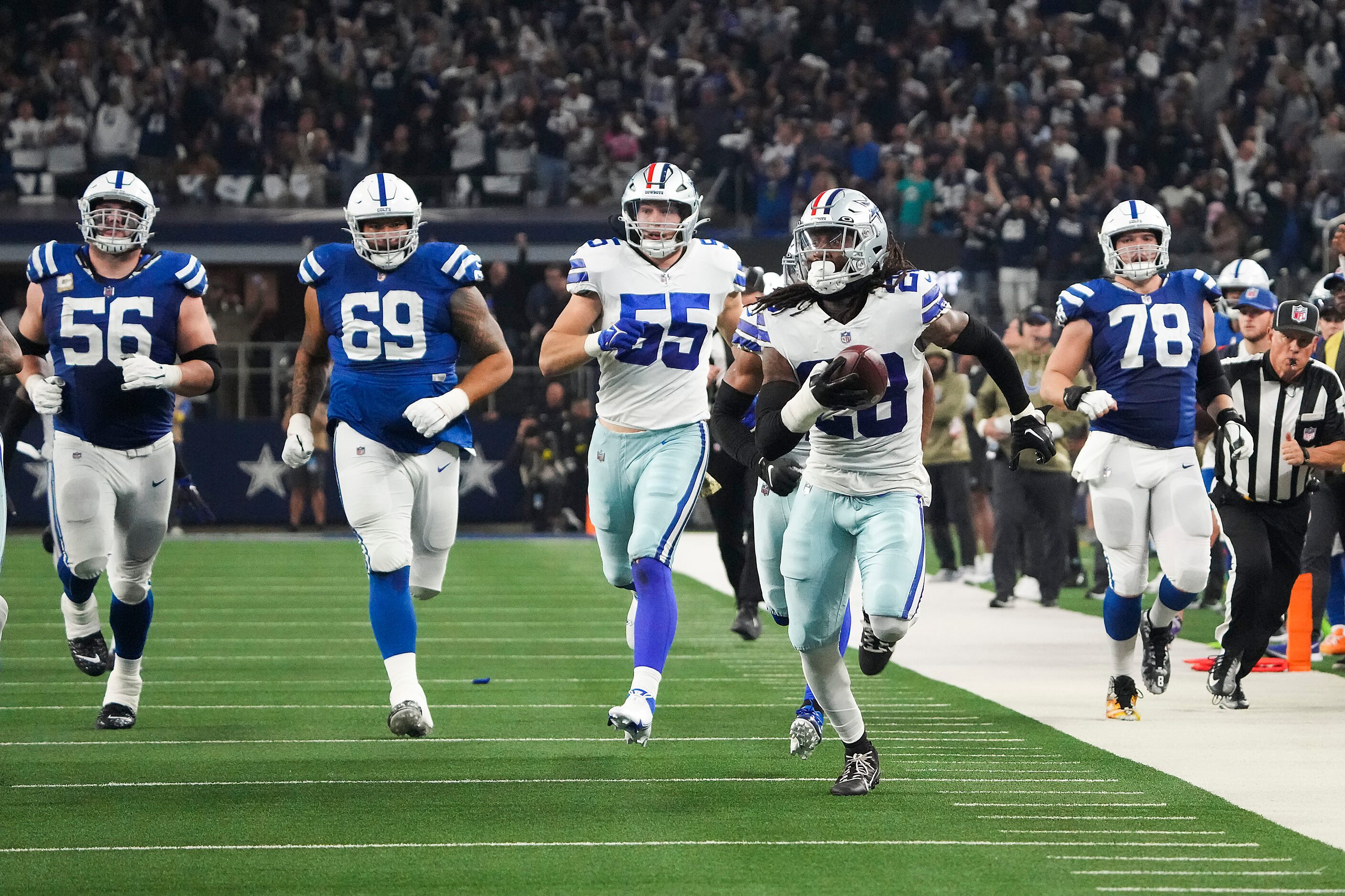 Dallas Cowboys safety Malik Hooker (28) recovers a fumble and returns it for a touchdown...