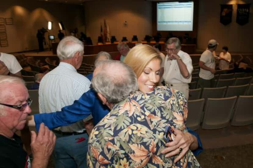 
Irving Mayor Beth Van Duyne (center) was met with hugs from supporters at City Hall on...