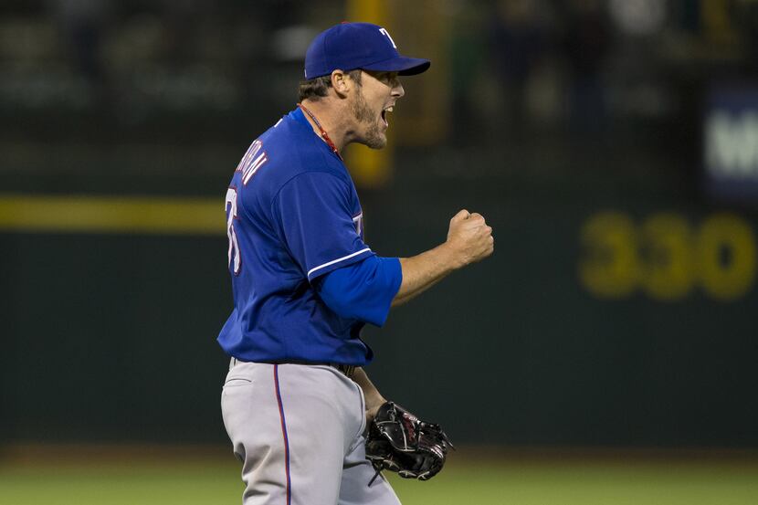 Texas closer Joe Nathan  celebrates after the final out of the Rangers' 6-5 win over the A's...
