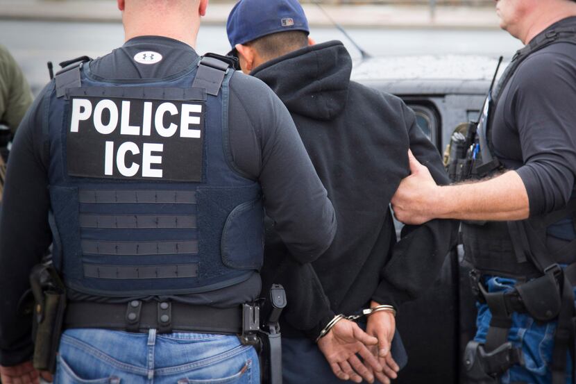 A photo released by U.S. Immigration and Customs Enforcement shows a foreign citizen being...