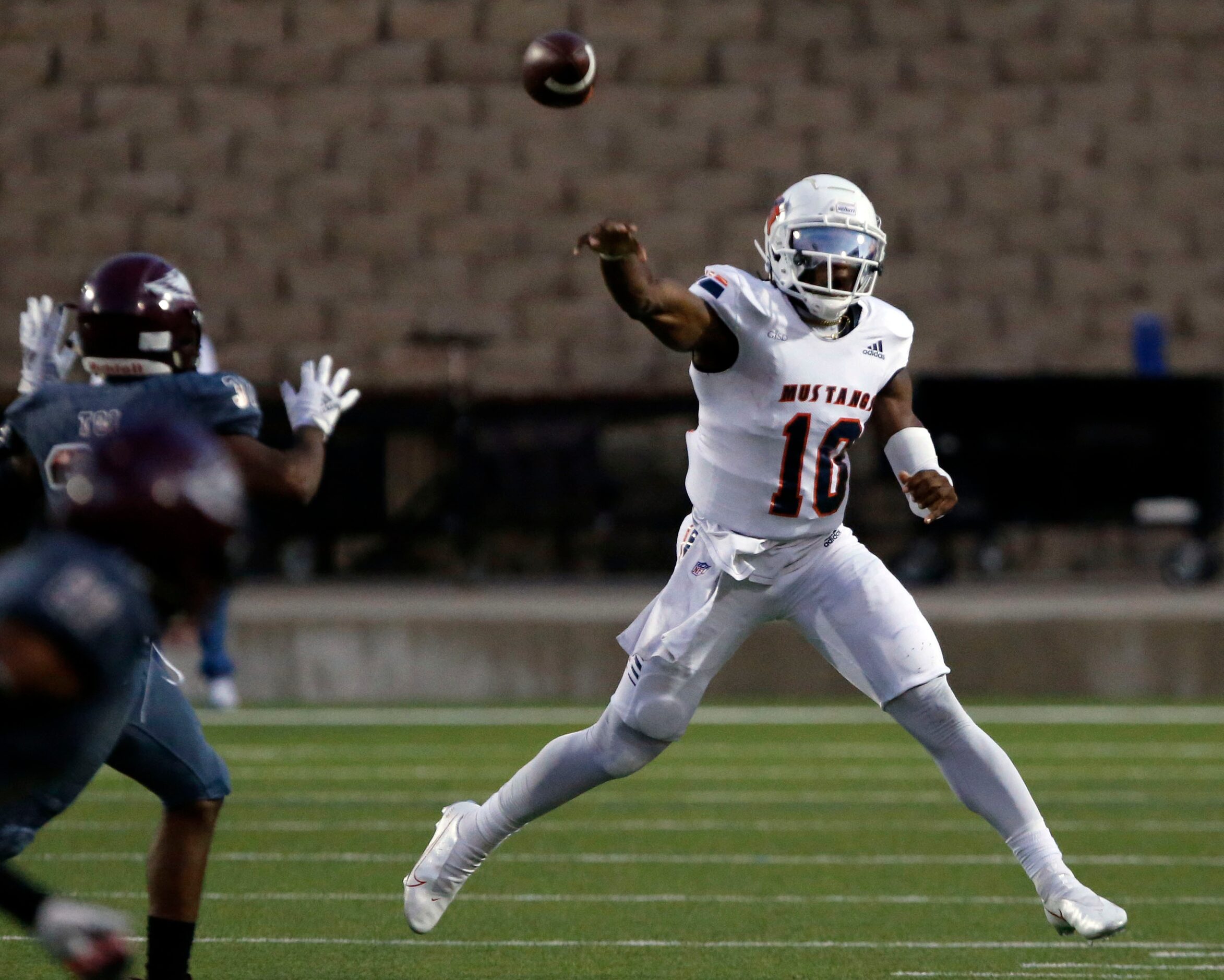 Sachse QB Alex Orji (10) throws a pass during the first half of a high school football game...