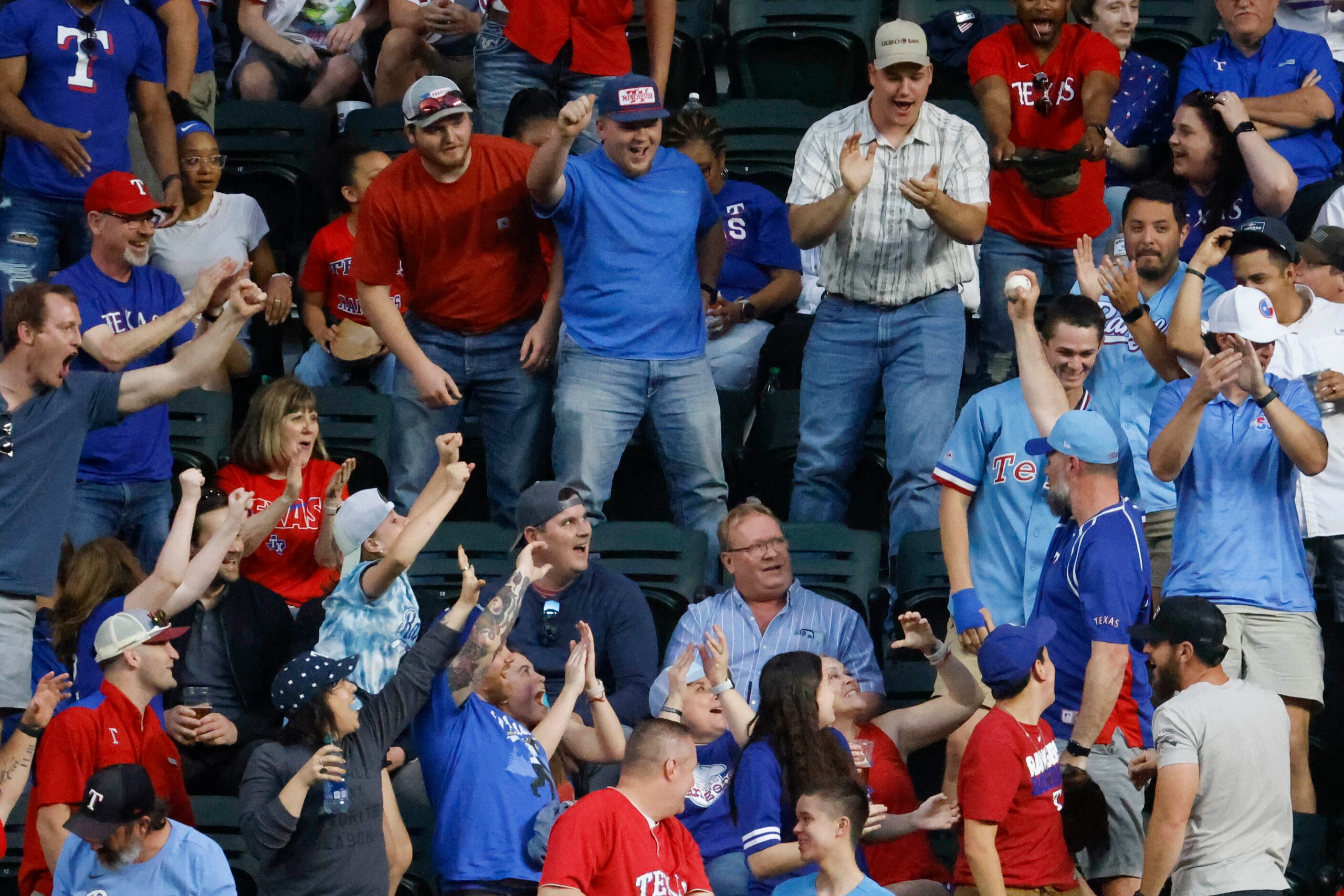 Crowd cheer after catching the home run ball by Kansas City Royals first baseman Vinnie...