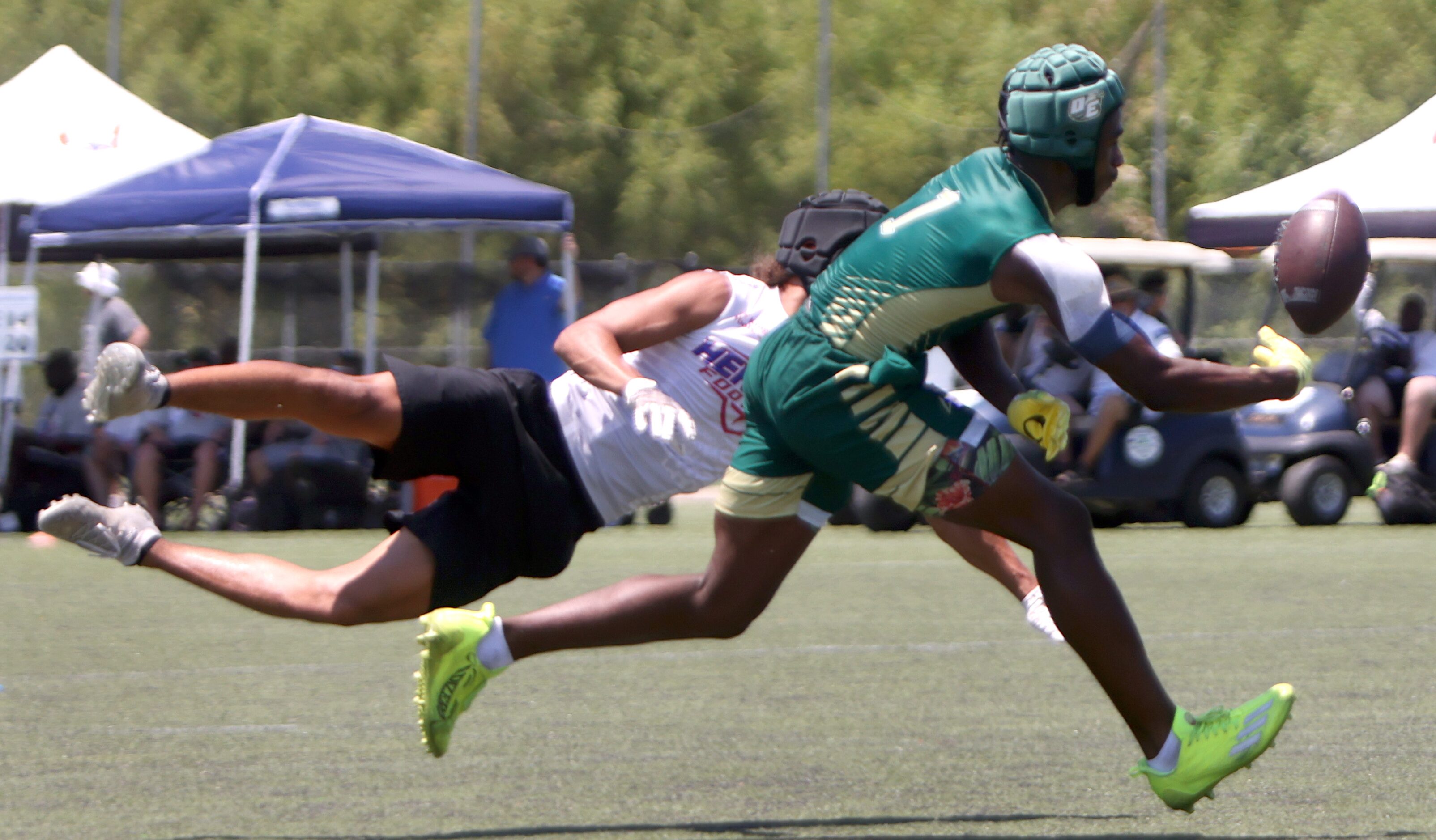 DeSoto receiver Johntay Cook ll (1), reaches for a pass as he is covered defensively by...