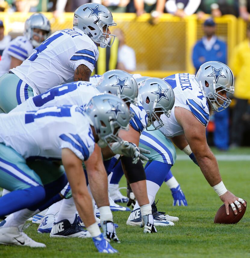 Dallas Cowboys quarterback Dak Prescott (4) calls the signals at the line of scrimmage...