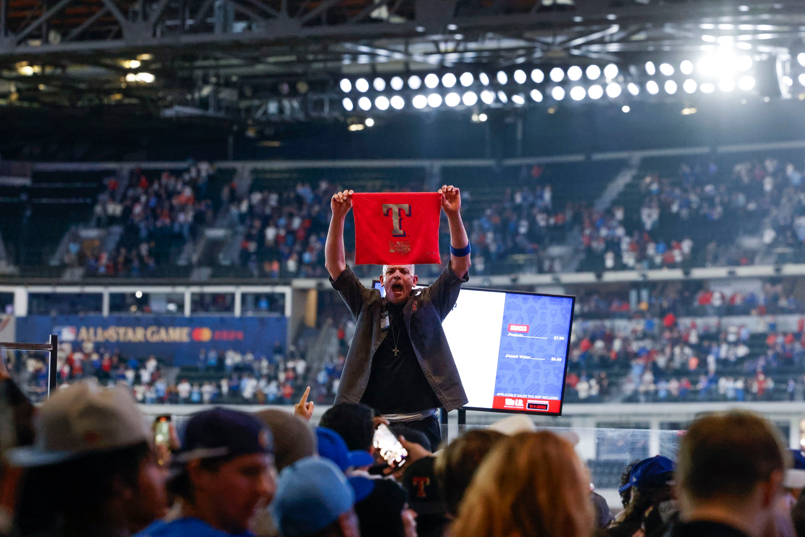 Fans cheer following Texas Rangers’ winning the World Series in five games against the...