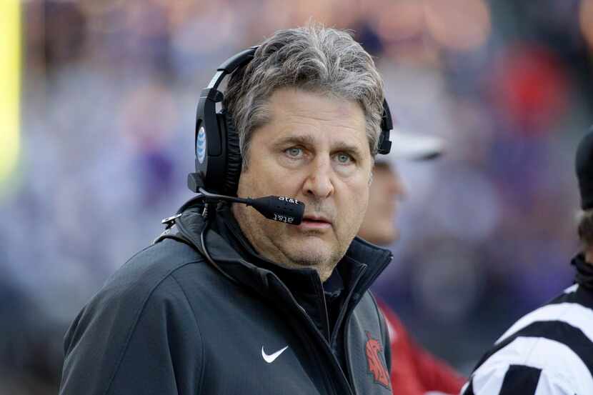 Washington State head coach Mike Leach stands on the sidelines in an NCAA college football...
