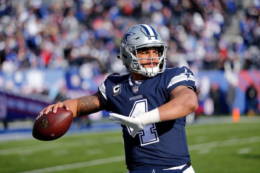 Dallas Cowboys quarterback Dak Prescott (4) warms up on the sideline before facing the New...