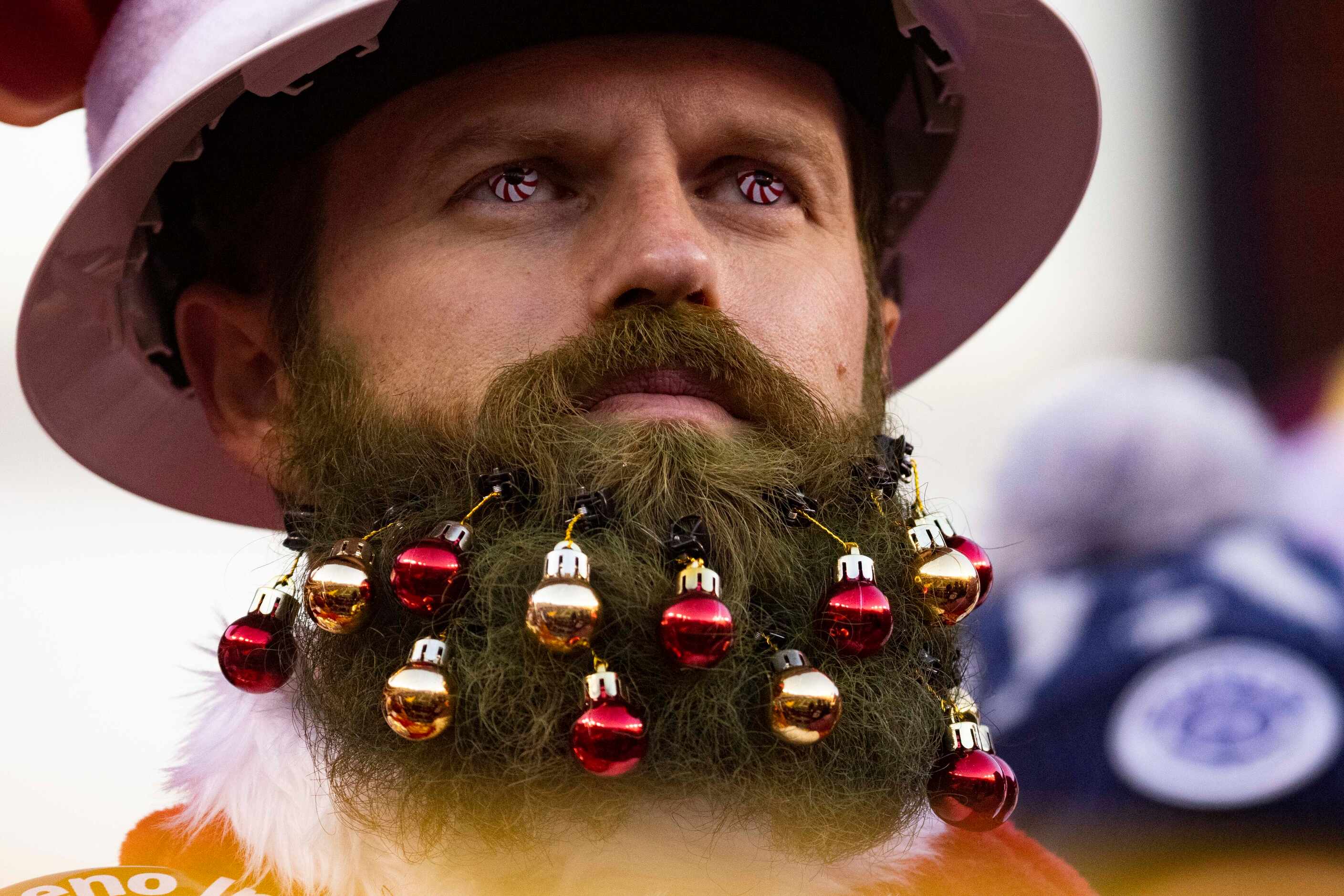 A Washington Football Team fan watches during the fourth quarter of an NFL game against...