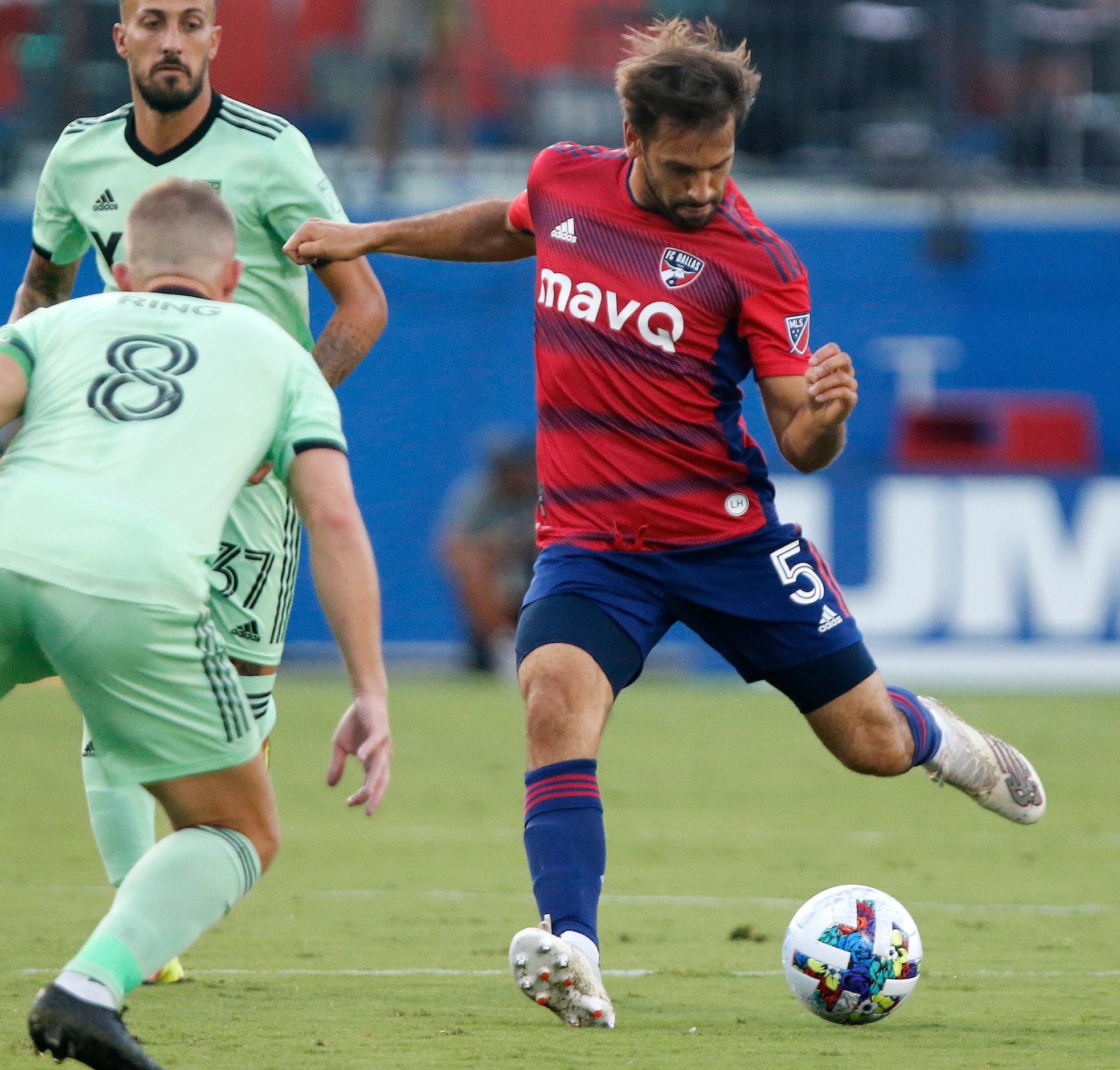 FC Dallas midfielder Facundo Quignon (5) takes a shot during the first half as FC Dallas...