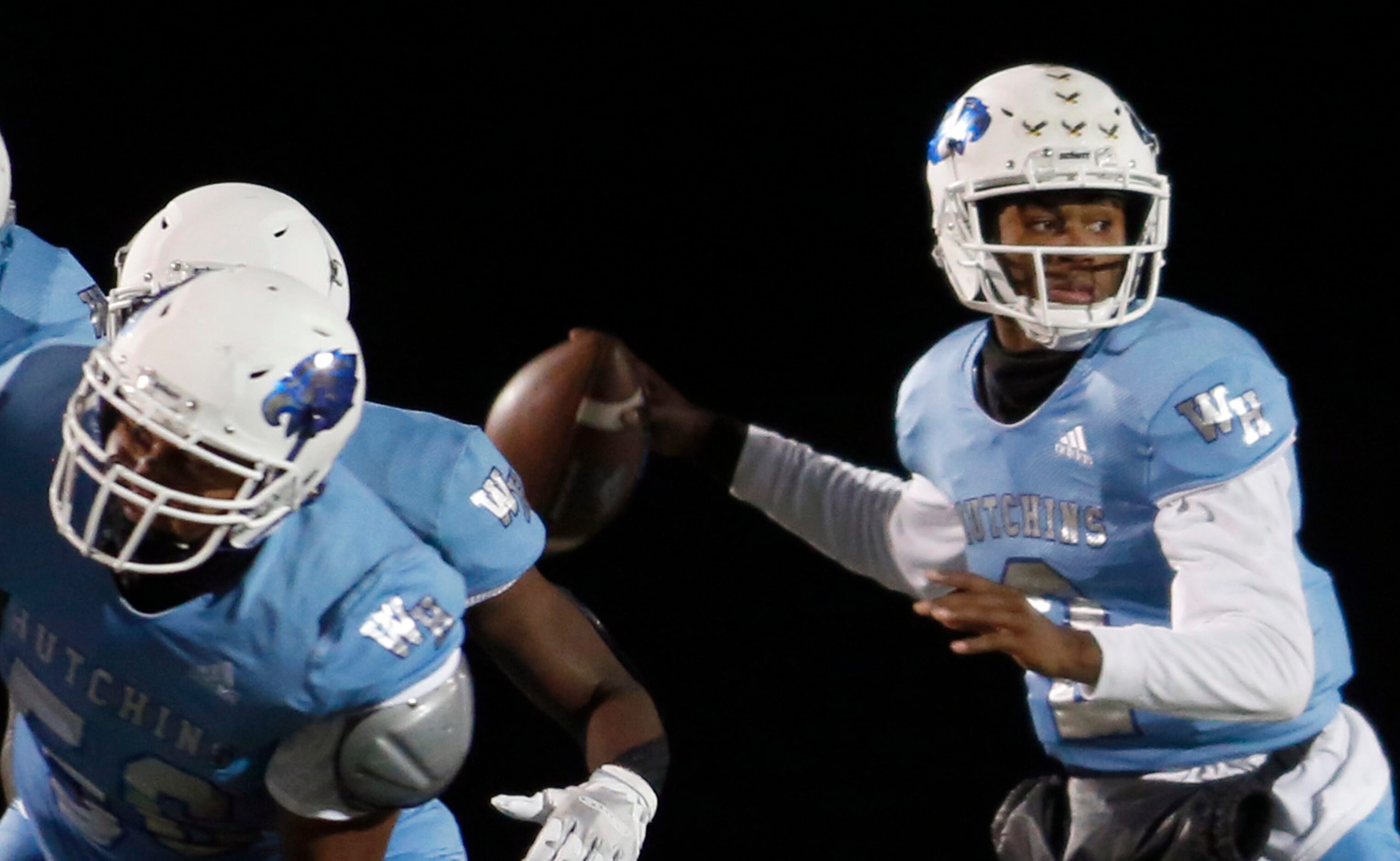 Wilmer Hutchins quarterback Andre Henderson (2) eyes a receiver downfield behind the...