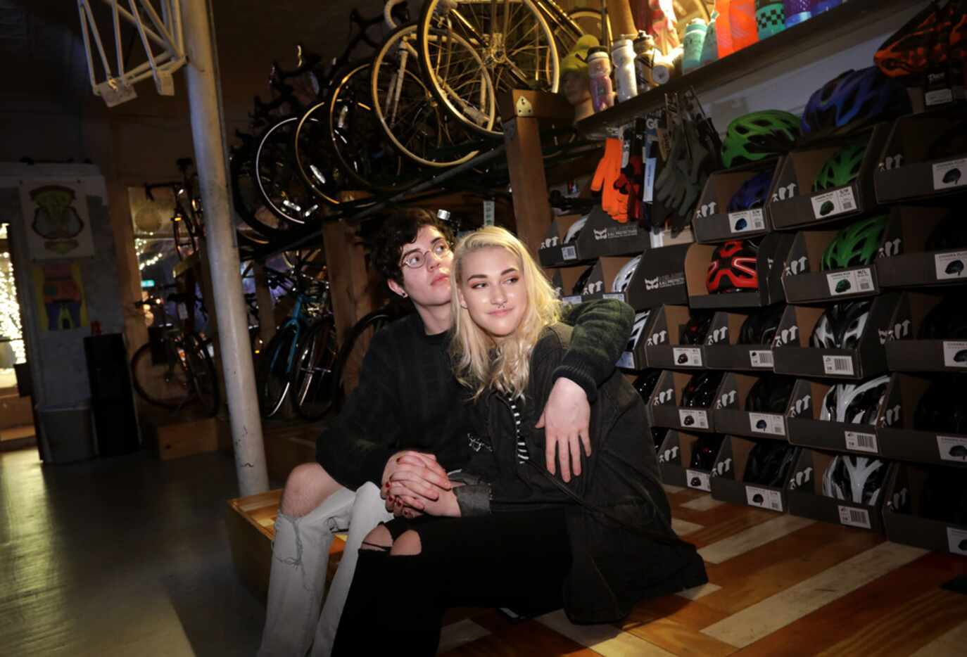 Max Woods (left) and Bailey Howell enjoy the music as Loafers perform at Transit Bicycle...