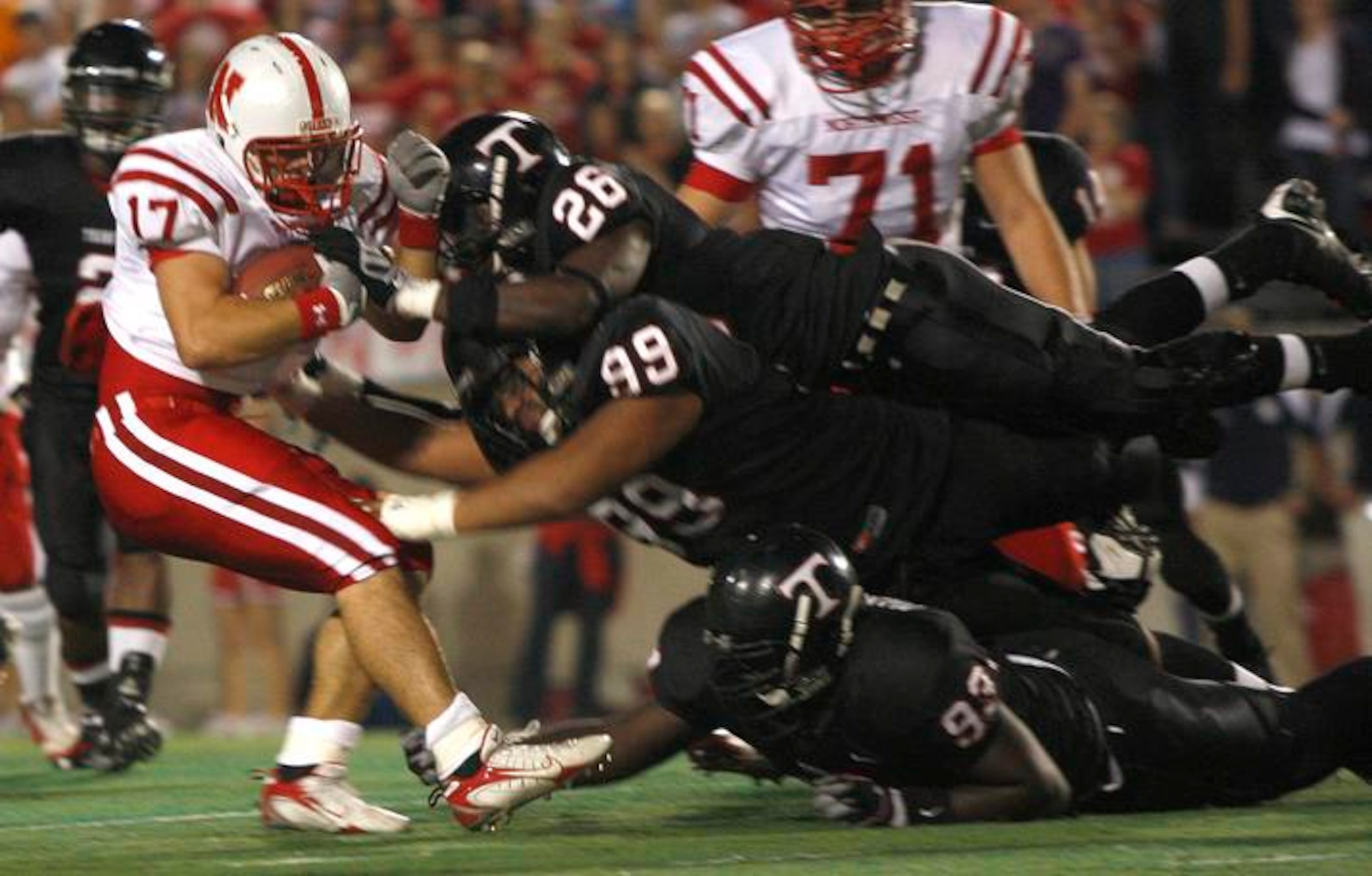 Justin Northwest senior running back Tyler Collins (17) is stopped by Euless Trinity's...