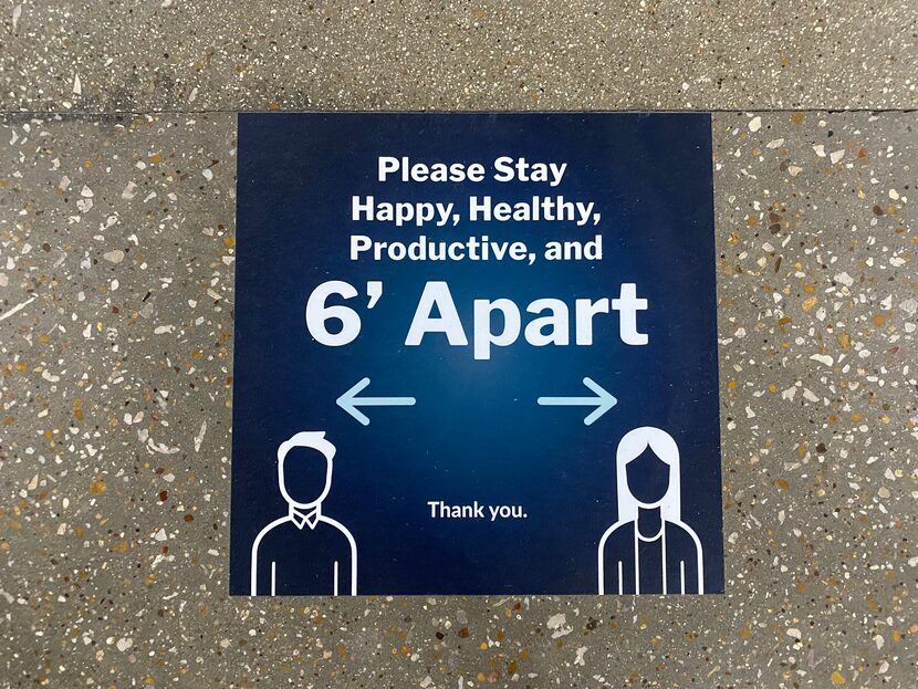 Directional signs in the hallways of Vari headquarters encourage one-way foot traffic with 6...