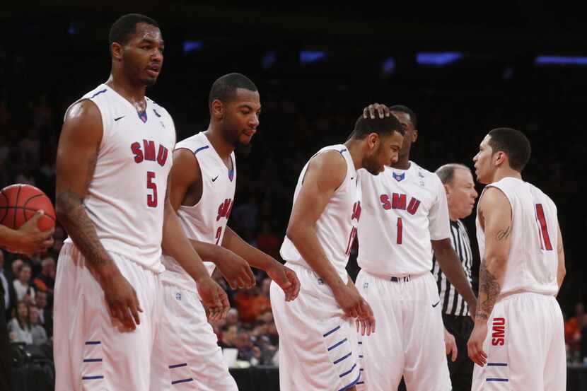 SMU players Markus Kennedy (5) Shawn Williams (2) Nick Russell (12)  Ryan Manuel (1) and Nic...