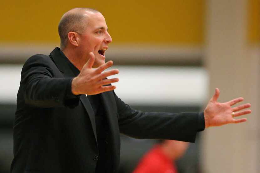 Plano East High School head coach Jeff Clarkson reacts to a non-call during the second...