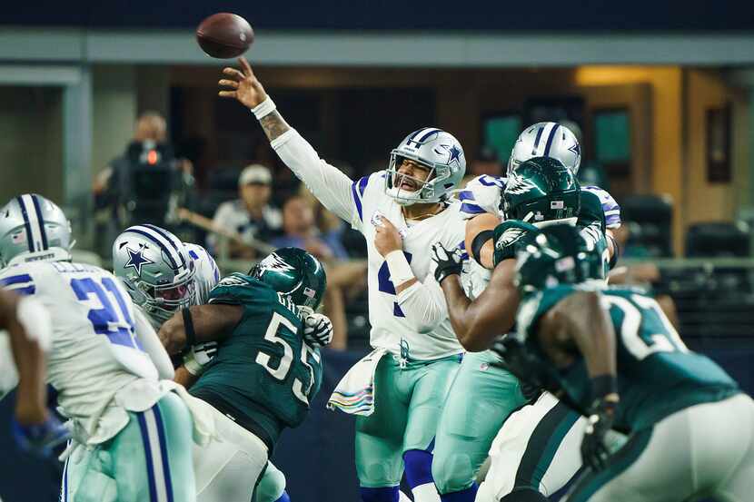 Dallas Cowboys quarterback Dak Prescott (4) throws a pass during the second quarter of an...