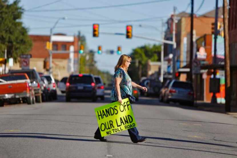 
Sharilin Brown of Nevada, Texas, joined a protest against the Northeast Gateway toll road...