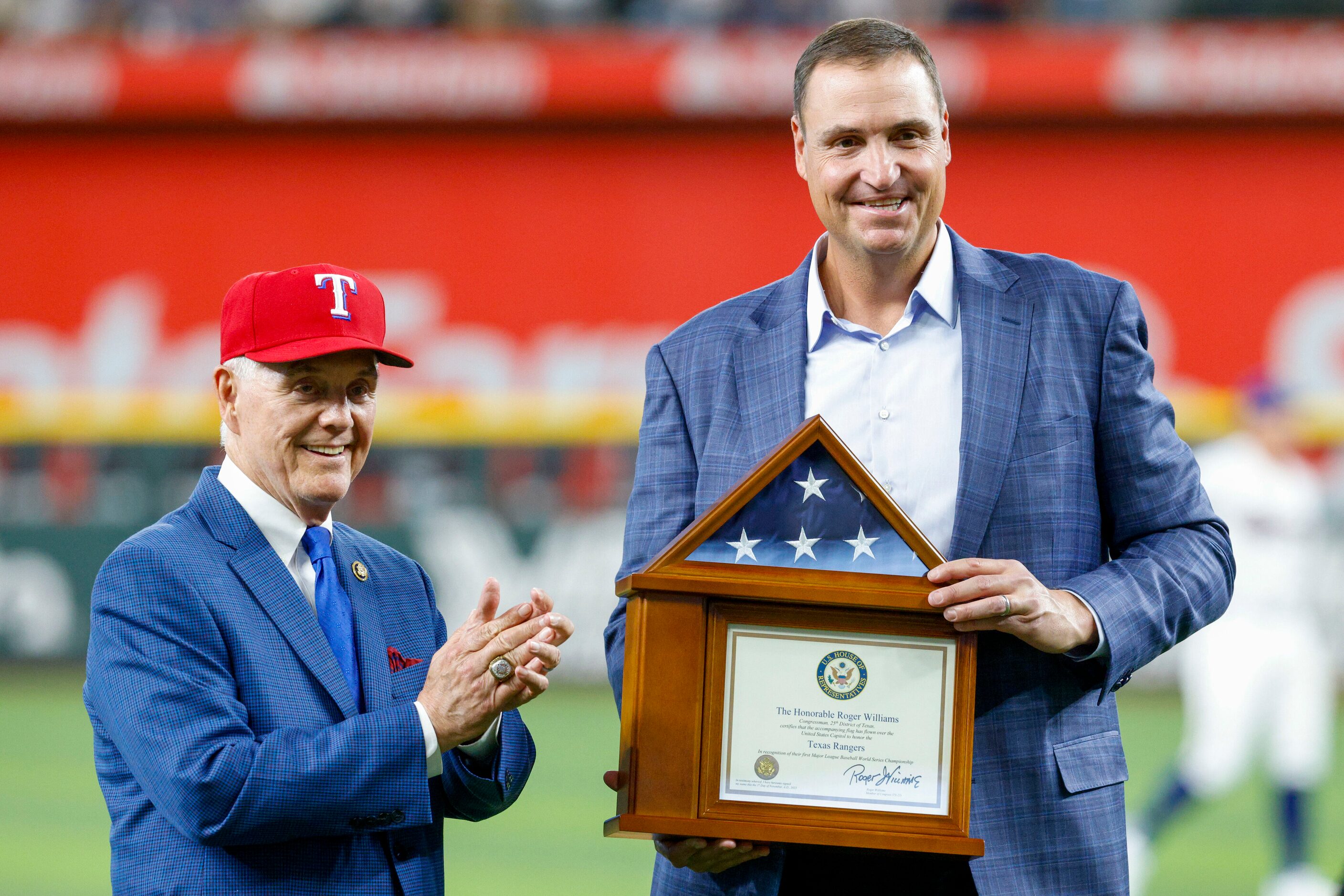 United States Congressman Roger Williams presents Texas Rangers executive vice president &...