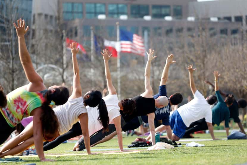 A free yoga class put on by the Dallas Yoga Center at Klyde Warren Park in Dallas.

