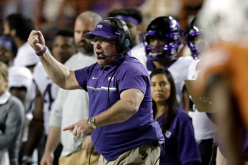 TCU head coach Gary Patterson calls to his players during the second half of an NCAA college...