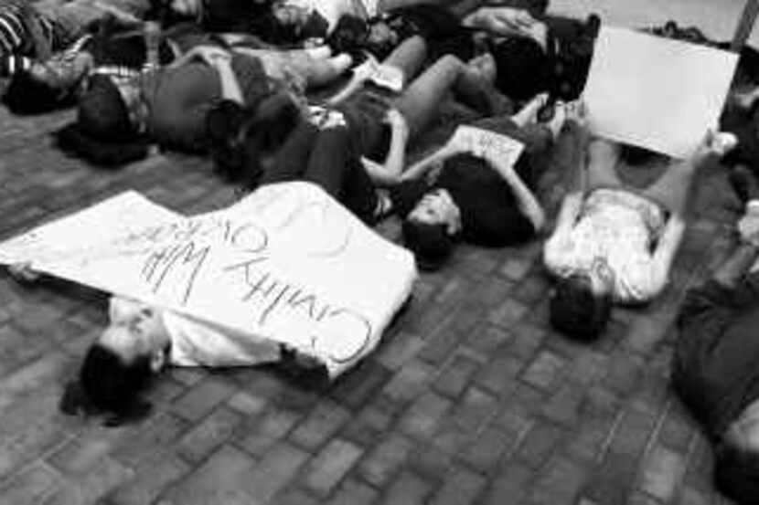  Rutgers University students took part in a 'lie-in' Wednesday in support of safe places for...